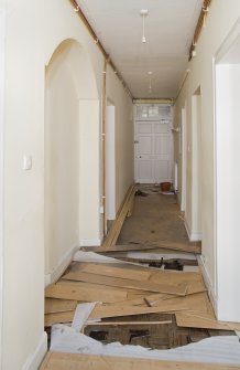 Interior. Basement. Passage with archway. View from NE