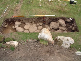 NW facing section of Trench 16, with paving F16.01 (2m & 0.5m)