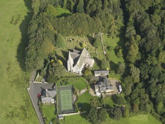 Oblique aerial view centred on the church, taken from the WSW.