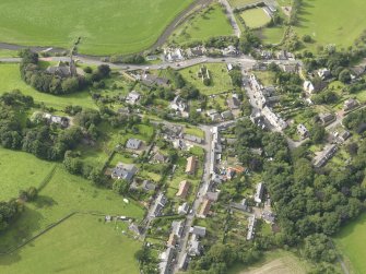 General oblique aerial view centred on the village, taken from the E.