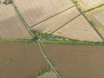 Oblique aerial view centred on the remains of the railway station, taken from the S.
