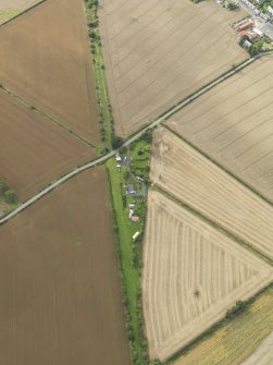 Oblique aerial view centred on the remains of the railway station, taken from the ENE.
