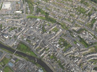 Oblique aerial view centred on the High Street, taken from the SW.