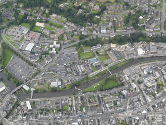 Oblique aerial view centred on the High Street, taken from the SE.