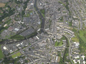 Oblique aerial view centred on the High Street, taken from the SE.