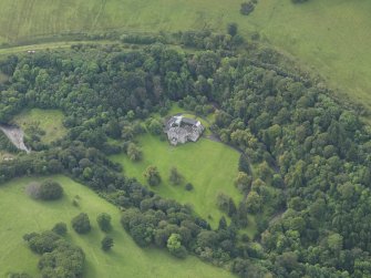 Oblique aerial view centred on the country house (castle), taken from the W.