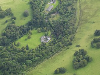 Oblique aerial view centred on the country house (castle), taken from the NNW.