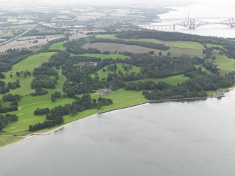 General oblique aerial view centred on the country house with Barnbougle Castle adjacent, taken from the E.