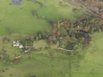 Oblique aerial view centred on the remains of the country house, taken from the S.