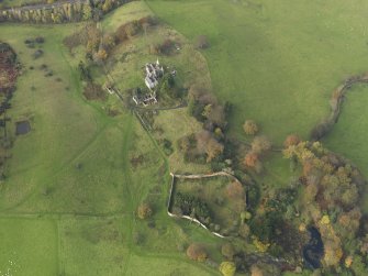 Oblique aerial view centred on the remains of the country house, taken from the ESE.