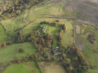 Oblique aerial view centred on the country house, taken from the W.