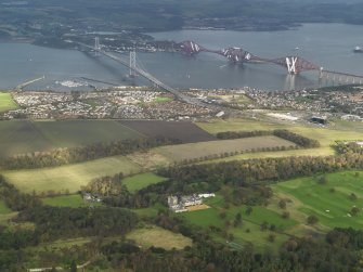 General oblique aerial view centred on the rail and road bridges, taken from the SW.