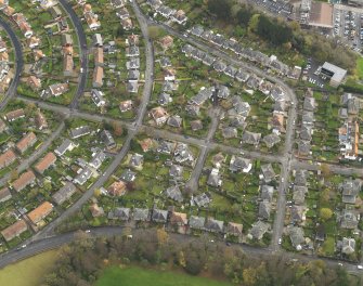 Oblique aerial view centred on part of the Silverknowes Housing Estate, taken from the NW.