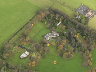 Oblique aerial view centred on castle with the policies adjacent, taken from the  SW.