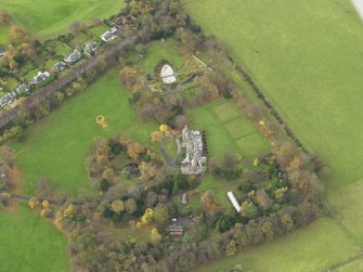Oblique aerial view centred on castle with the policies adjacent, taken from the  ESE.