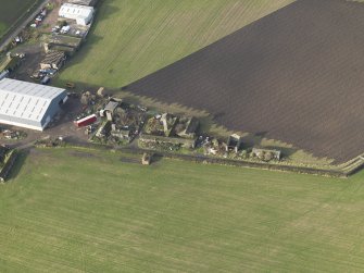 Oblique aerial view centred on the domestic site, taken from the SE.
