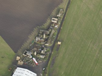 Oblique aerial view centred on the domestic site, taken from the SW.