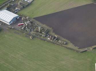Oblique aerial view centred on the domestic site, taken from the SE.