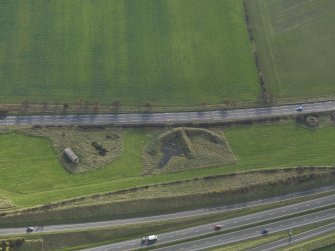 Oblique aerial view centred on the dispersal bay (e pen) with a pillbox adjacent,  taken from the N.