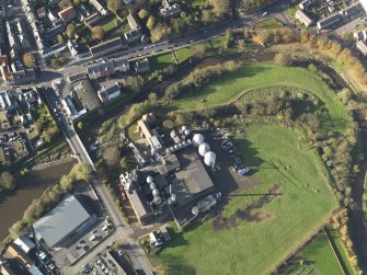 Oblique aerial view centred on the mills, taken from the E.