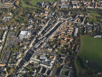 General oblique aerial view centred on the central area of the town, taken from the SW.