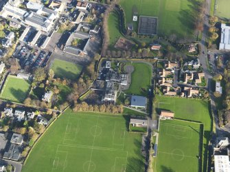 Oblique aerial view centred on the school, taken from the SW.