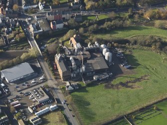 Oblique aerial view centred on the mills, taken from the E.