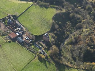 Oblique aerial view centred on the tower house with the farmstead adjacent, taken from the NE.