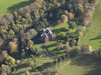 Oblique aerial view centred on the tower house/country house, taken from the NW.