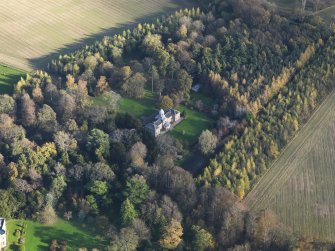 Oblique aerial view centred on the stable block, taken from the W.