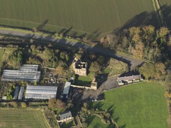 Oblique aerial view centred on the country/tower house, taken from the, taken from the S.