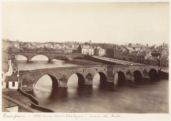 General view looking down on bridges across the Nith.
