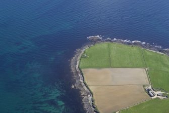 Oblique aerial view of the remains of the East Broch of Burray, taken from the W.
