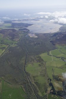 General oblique aerial view of Strath Fleet looking across The Alders and The Mound towards Loch Fleet, taken from the NNW.
