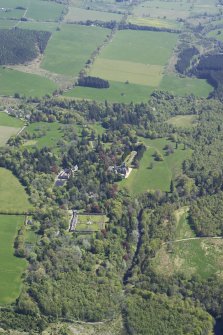 General oblique aerial view of the policies and gardens around Ardross Castle, taken from the WNW.