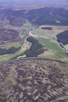General oblique aerial view looking down the River Findhorn with the A9 in the centre and the patchwork of heather burning on Tom na h'Ulaidh in the foreground, taken from the SW.