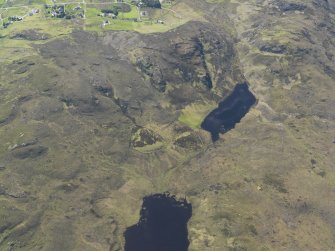 Oblique aerial view centred on the enclosures at Loch Coire an h-Airigh, taken from the E.