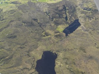 Oblique aerial view centred on the enclosures at Loch Coire an h-Airigh, taken from the E.