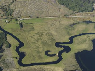 General oblique aerial view of Achanalt including the old river channels, taken from the S.