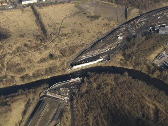 Oblique aerial view of M74 extension centred on the Dalbeth Bridge, taken from the S.