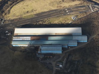 Oblique aerial view centred on the steel works, taken from the SSW.