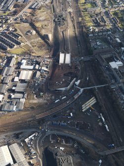 Oblique aerial view of the city showing the route of the M74 extension going through the Rutherglen area centred on Rutherglen railway station, taken from the W.