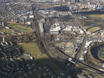 Oblique aerial view of the city showing the route of the M74 extension going through the Rutherglen to Polamadie area centred on Power Motive Works, taken from the ESE.