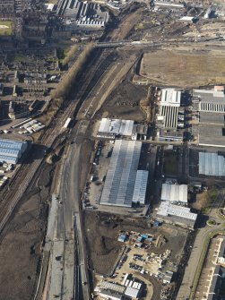 Oblique aerial view of the M74 extension going through the Polamadie area to the M74 centred on Gushetfaulds railway junction, taken from the ESE.