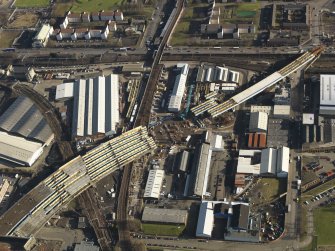 Oblique aerial view of the M74 extension going through the Port Eglinton area to the M74 centred on the Eglinton Street goods station, taken from the WSW.