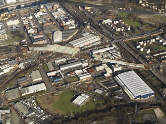 Oblique aerial view of the M74 extension going through the Port Eglinton area to the M74 centred on the Eglinton Street goods station, taken from the SW.