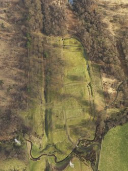 Oblique aerial view centred on the remains of Rough Castle Roman fort and the course of the Antonine Wall, taken from the WSW.