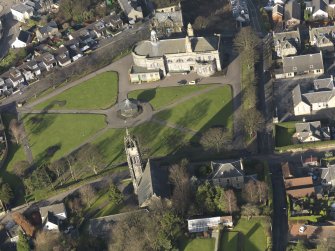 General oblique aerial view of the park centred on the town hall and church, taken from the S.