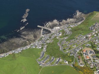 Oblique aerial view of the village of Gardenstown, taken from the SSW.