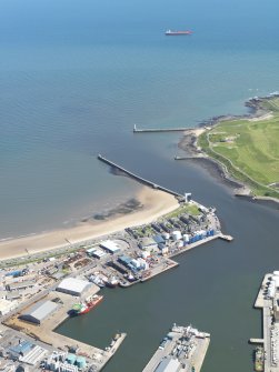 Oblique aerial view of the harbour and docks at Aberdeen, taken from the NW.